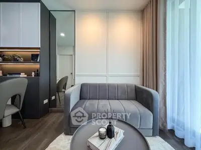 Modern living room with sleek gray sofa and stylish decor