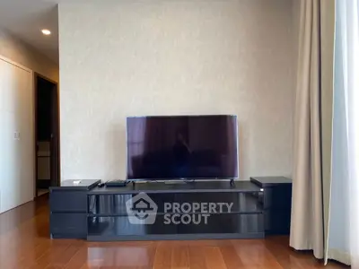 Modern living room with sleek TV stand and hardwood floors