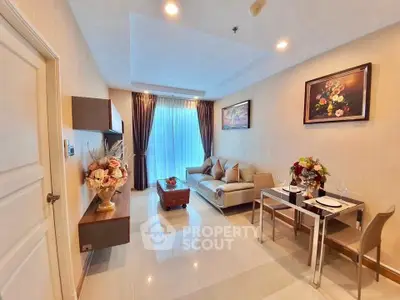 Elegant living room with modern decor, plush sofa, and dining area in a stylish apartment.