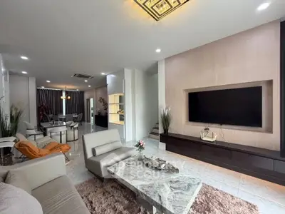 Luxurious modern living room with elegant decor and spacious layout, perfect for relaxation and entertainment.