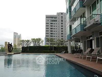Luxurious condominium with poolside view and modern architecture