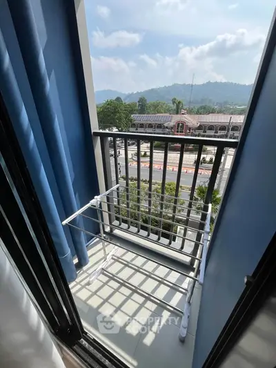 Charming balcony with scenic mountain view, perfect for relaxation and enjoying fresh air.