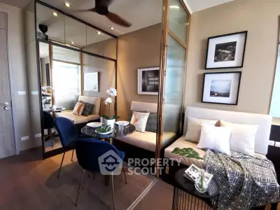 Stylish modern living room with mirrored wall and cozy seating area