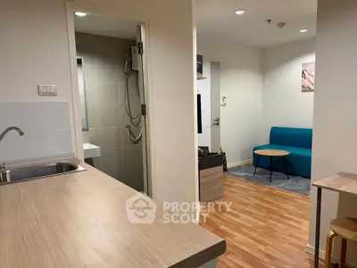 Modern apartment interior with open kitchen and cozy living area