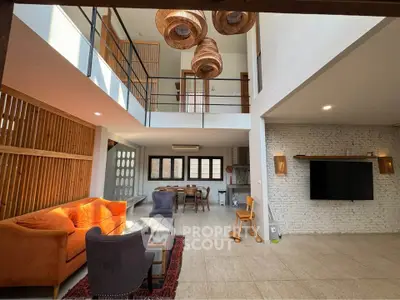 Spacious modern living room with high ceilings and stylish decor