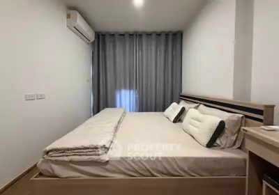 Modern bedroom with cozy bed and stylish curtains in a minimalist design.