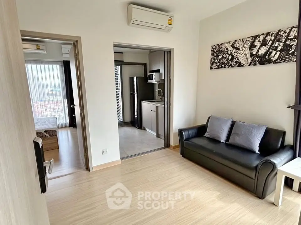 Modern apartment interior with cozy living room and compact kitchen
