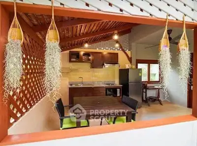 Charming open-layout kitchen with rustic wooden accents and modern appliances.