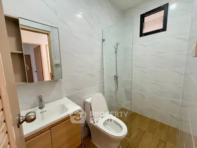 Modern bathroom with sleek design and glass shower enclosure