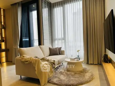 Luxurious living room with modern decor and large windows