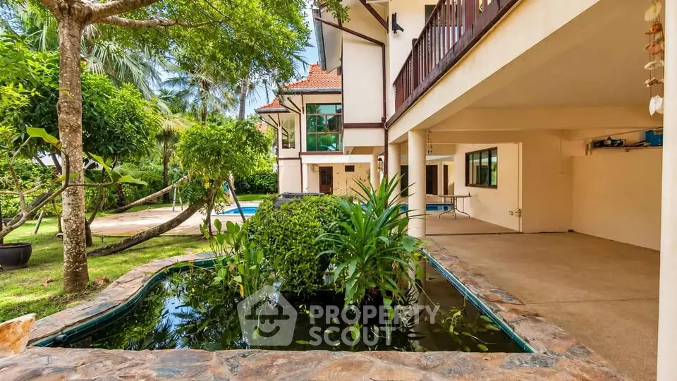 Stunning tropical villa with lush garden and pool, perfect for luxury living.