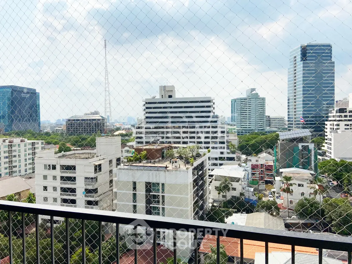 Stunning cityscape view from a high-rise balcony showcasing modern urban architecture and skyline.