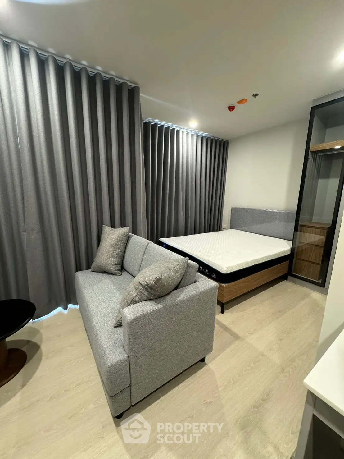 Modern living room with sleek design and cozy furniture