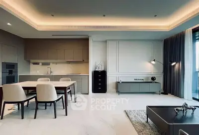 Modern open-plan living room with sleek kitchen and elegant dining area