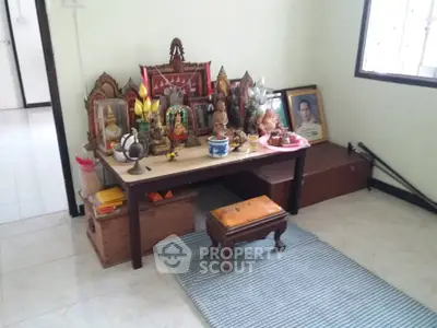 Charming room with a traditional altar setup, perfect for a serene home environment.