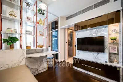 Modern living room with marble accents and built-in TV, featuring stylish shelving and cozy seating.