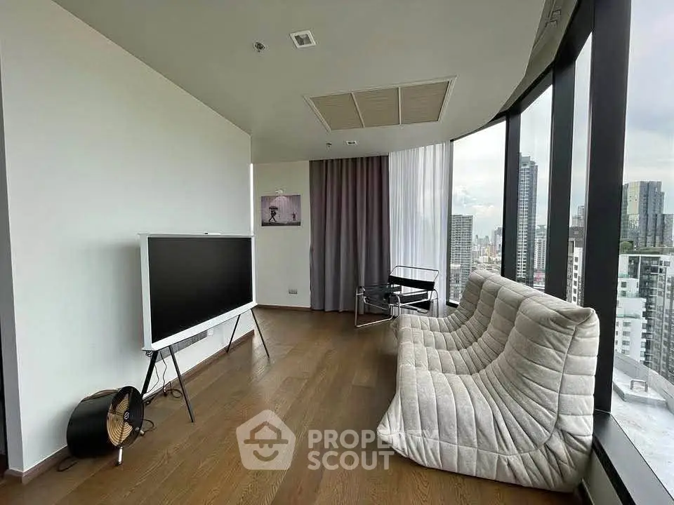 Modern living room with panoramic city views and stylish furniture