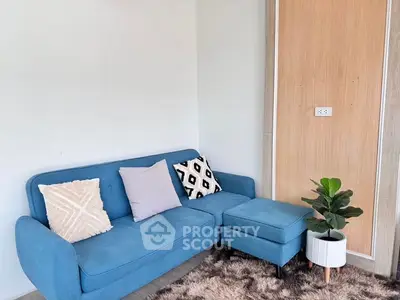 Stylish living room with blue sofa and cozy decor