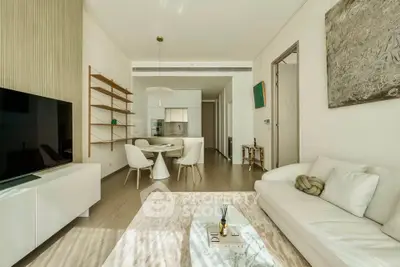 Modern living room with elegant decor and open kitchen layout