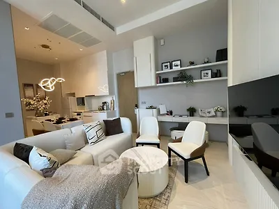 Modern living room with stylish decor and open kitchen layout