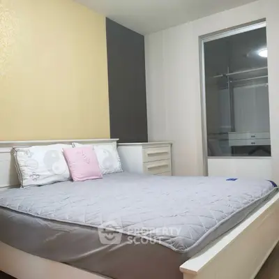 Cozy bedroom with modern design and ample storage space, perfect for relaxation and comfort.