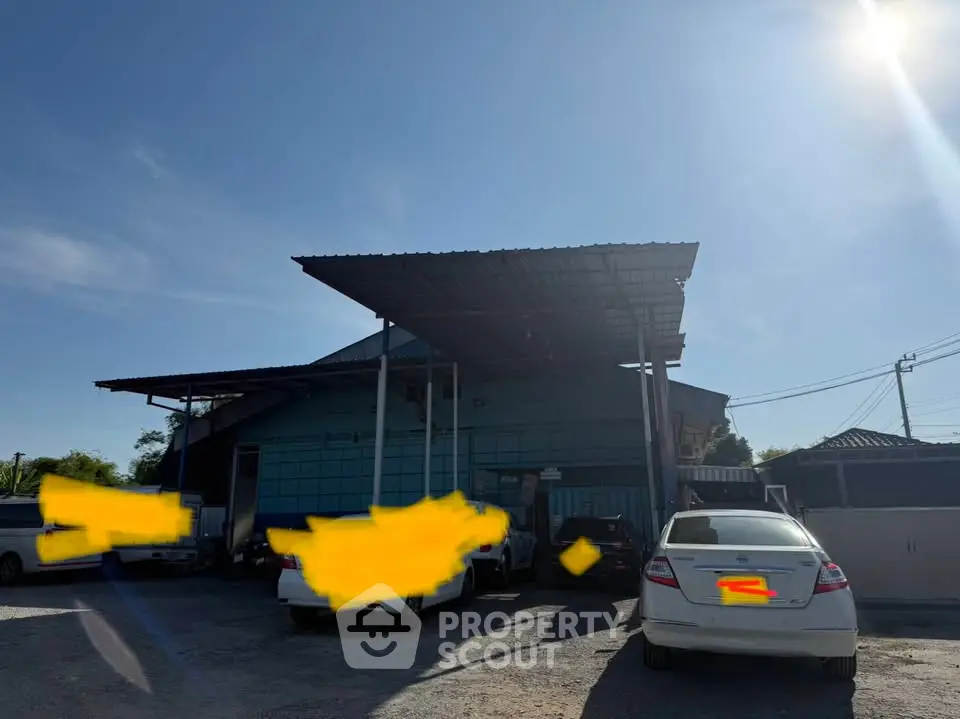 Spacious industrial warehouse with ample parking and modern design.