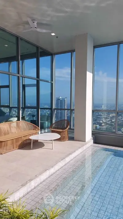 Luxurious high-rise balcony with stunning city view and private pool.