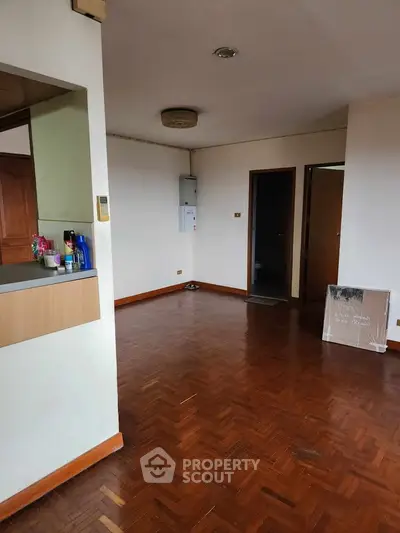 Spacious living room with wooden flooring and open layout