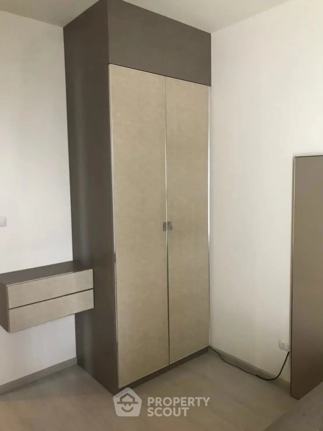 Modern bedroom with sleek built-in wardrobe and minimalist design