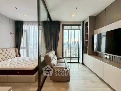 Modern apartment with glass partition, cozy living area, and city view balcony.