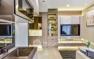 Modern living room with sleek design, built-in shelves, and large TV, perfect for stylish urban living.