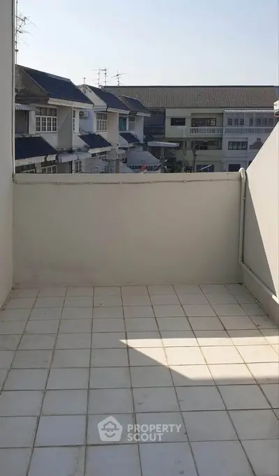 Spacious balcony with city view, perfect for relaxation and outdoor activities.