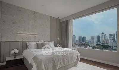 Luxurious bedroom with stunning city view and elegant decor