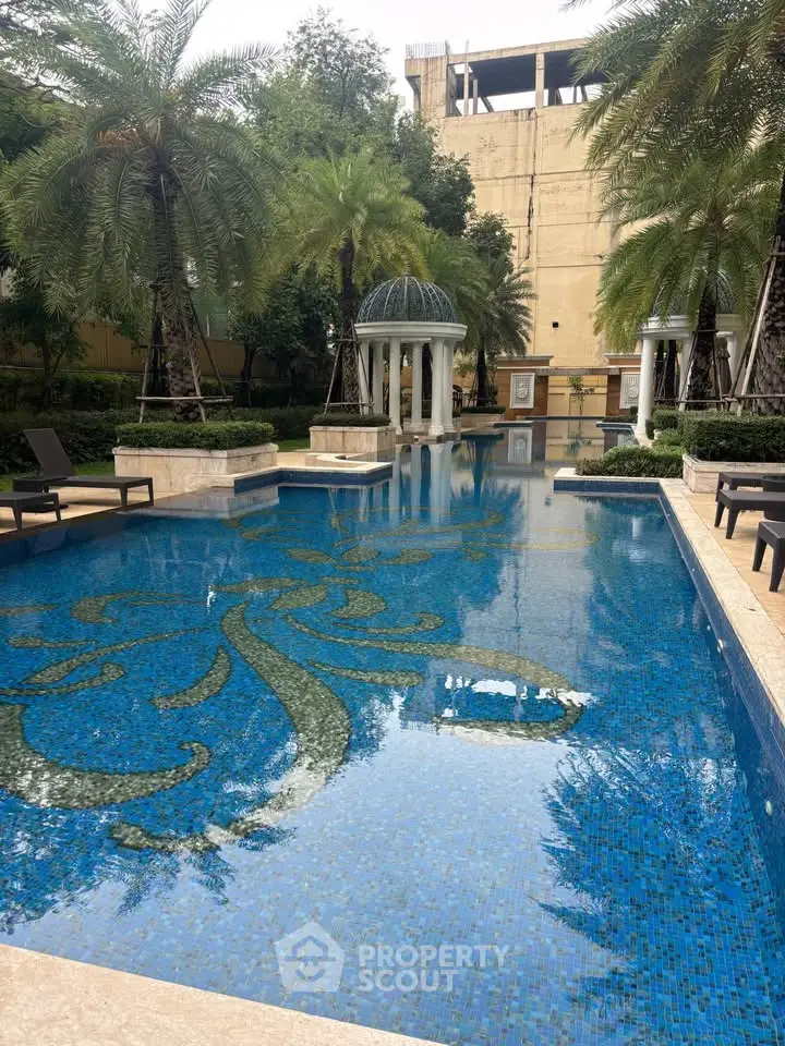 Luxurious outdoor pool with elegant design and lush greenery