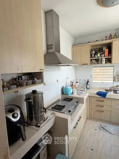 Charming kitchen with modern appliances and ample storage space, perfect for culinary enthusiasts.