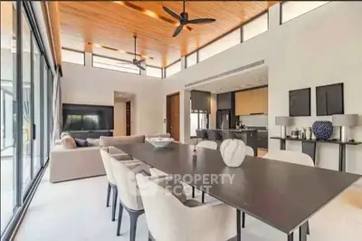 Spacious modern living room with open kitchen and elegant dining area