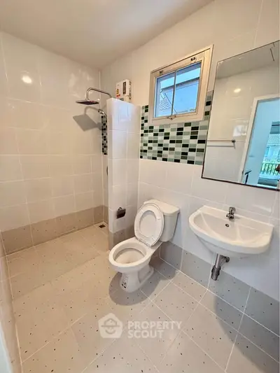 Modern bathroom with sleek fixtures and stylish tile accents