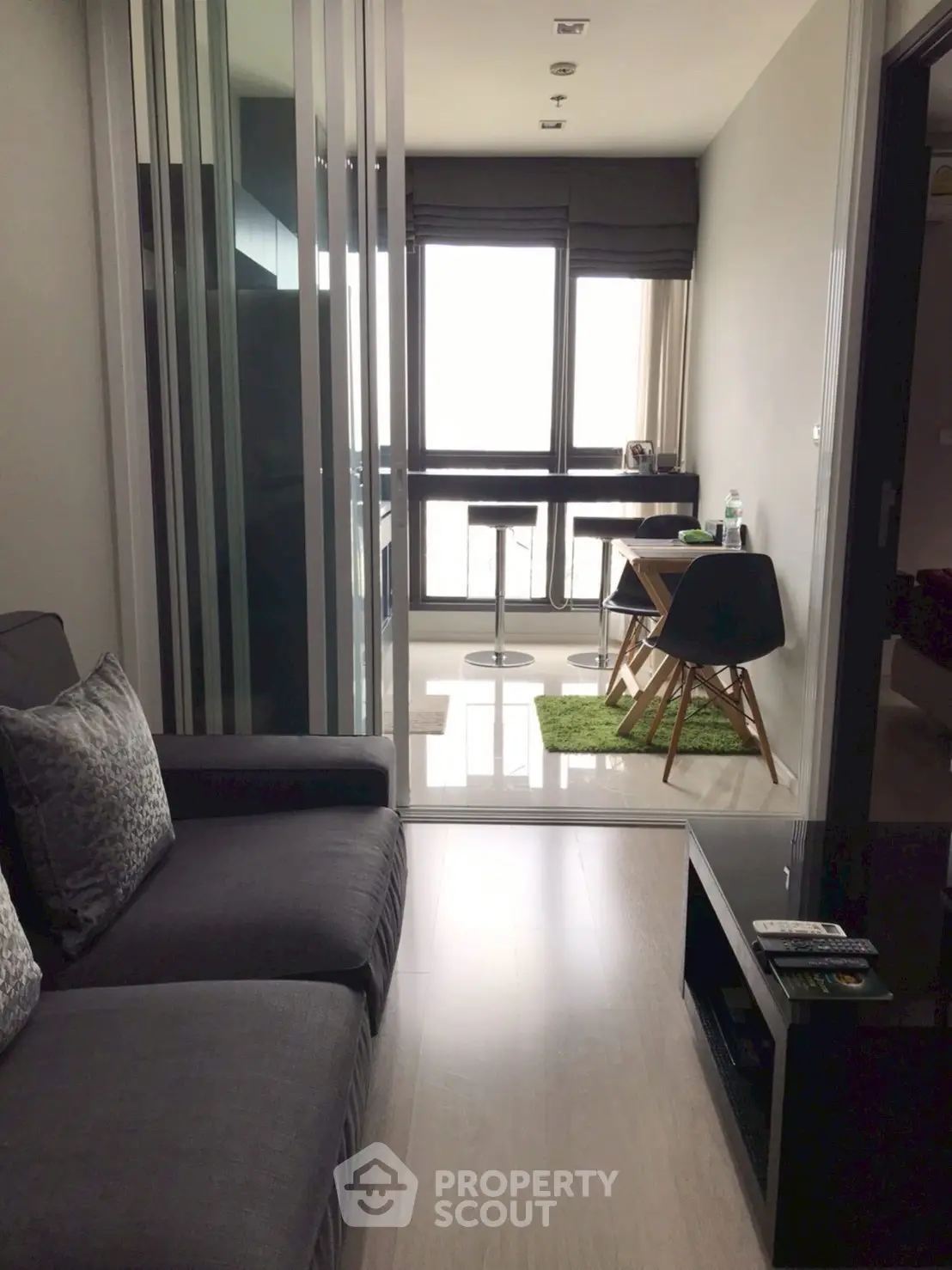 Modern apartment with cozy living area and stylish dining nook