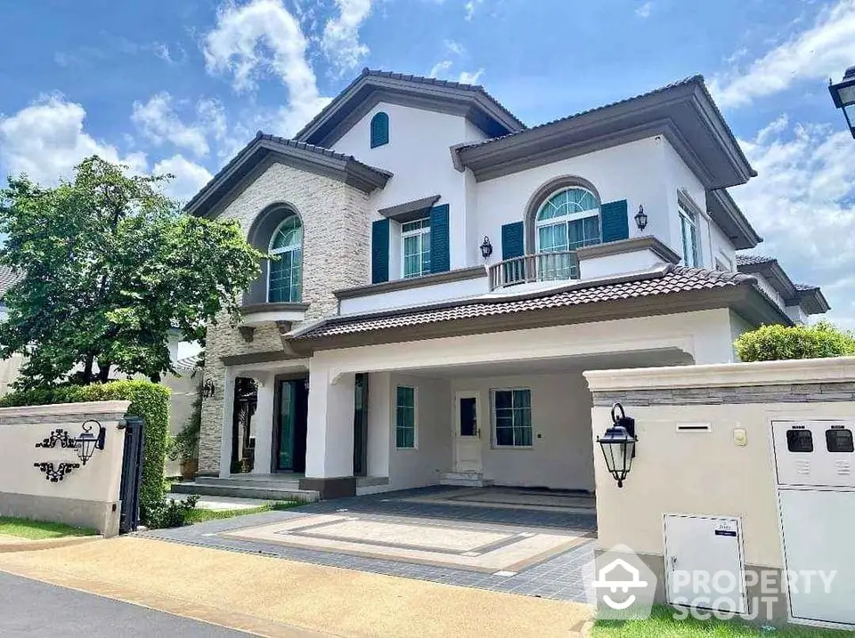 Elegant two-story house with modern architecture and spacious driveway