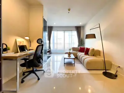 Modern living room with cozy sofa and stylish workspace in bright apartment
