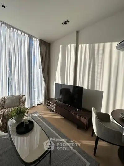 Modern living room with natural light and stylish furniture