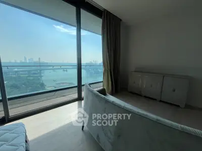 Luxurious living room with stunning waterfront view and modern furniture