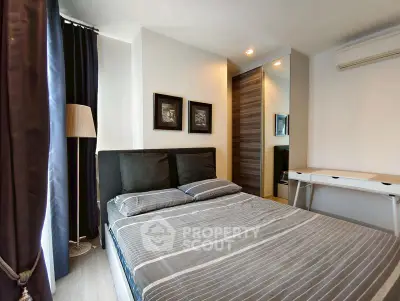 Modern bedroom with stylish decor and ample natural light