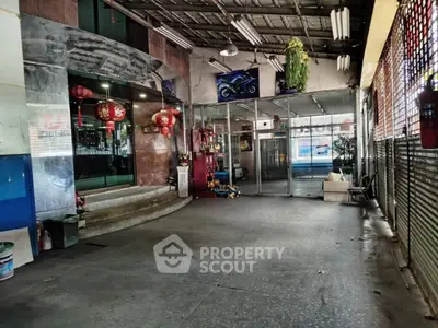 Spacious commercial property entrance with glass doors and decorative elements