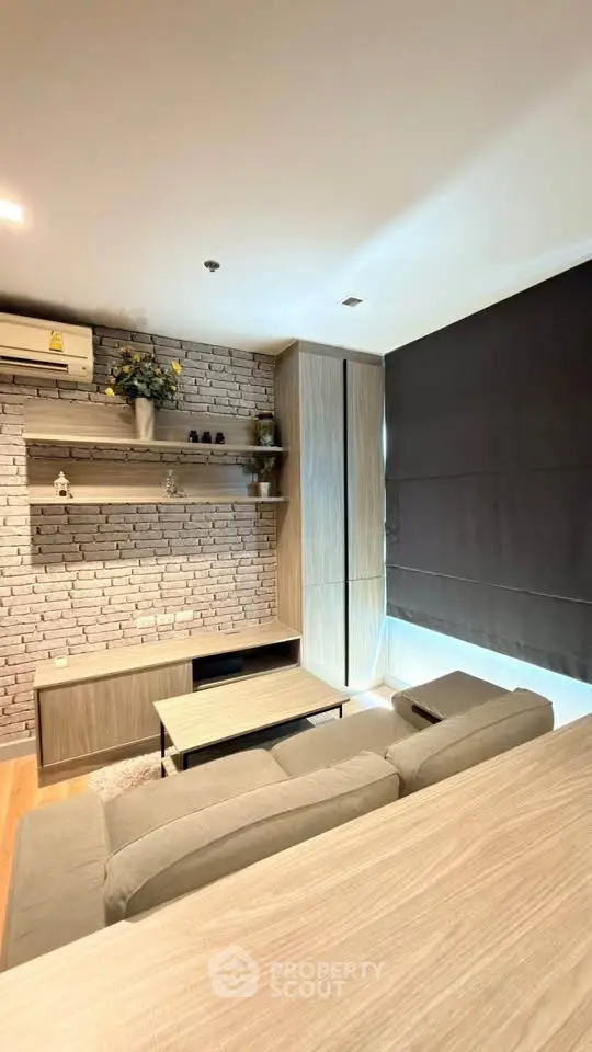 Modern living room with stylish brick wall and cozy seating area
