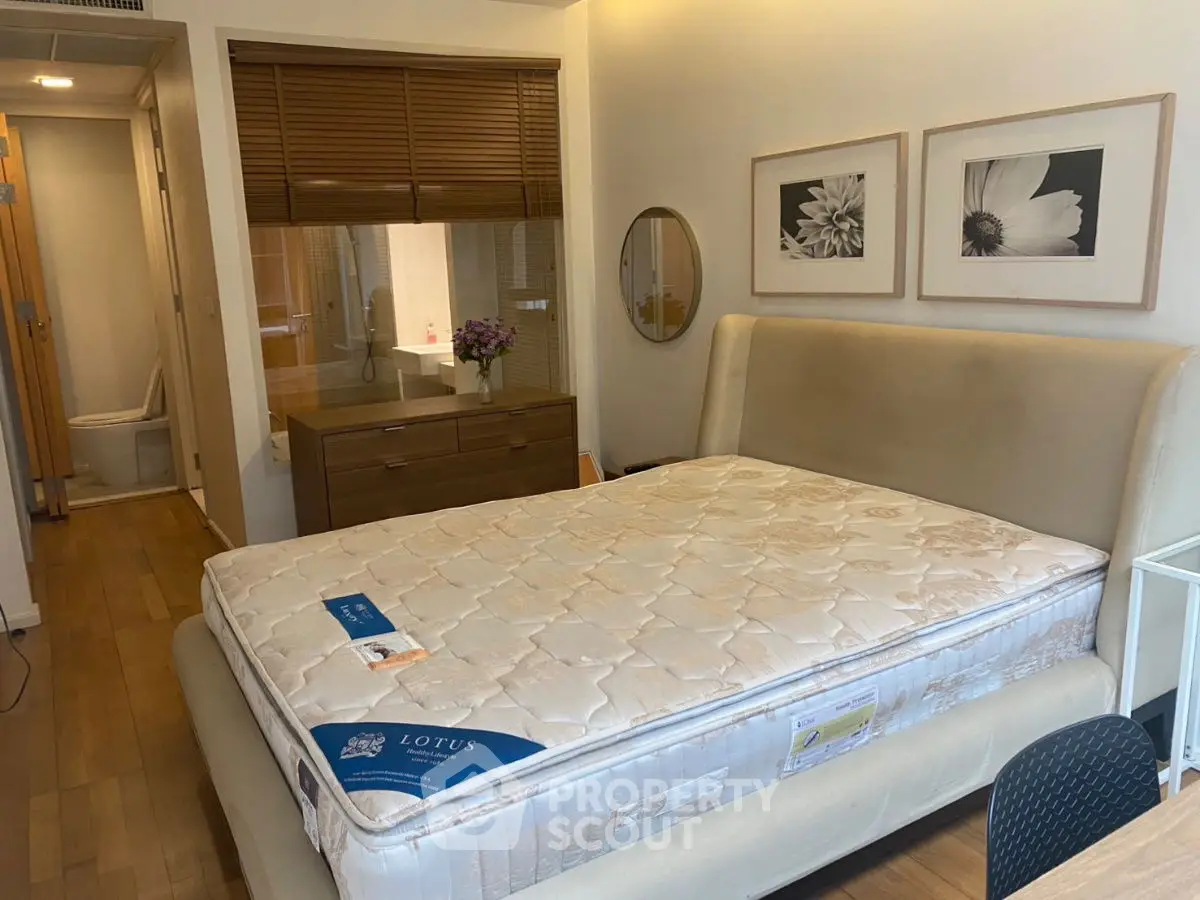 Cozy bedroom with elegant decor and comfortable mattress, perfect for relaxation.