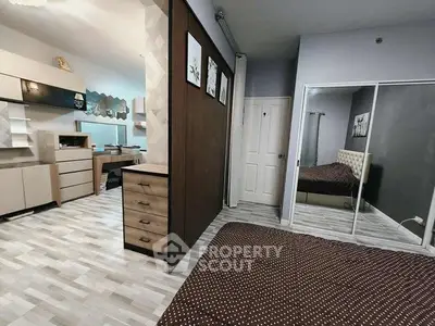 Modern bedroom with mirrored closet and stylish decor