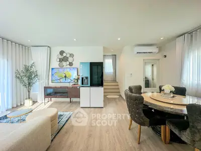 Spacious modern living room with elegant dining area and stylish decor