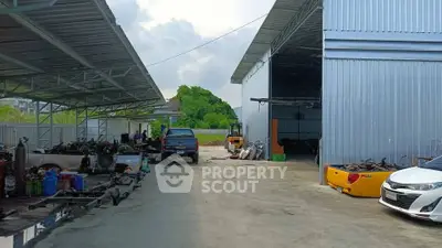 Spacious industrial property with ample outdoor storage and parking space.