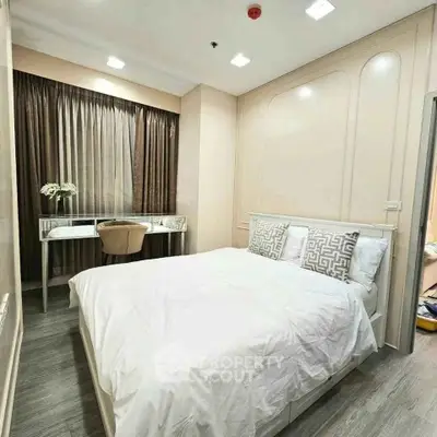 Modern bedroom with elegant decor and natural light, featuring a cozy bed and stylish desk.